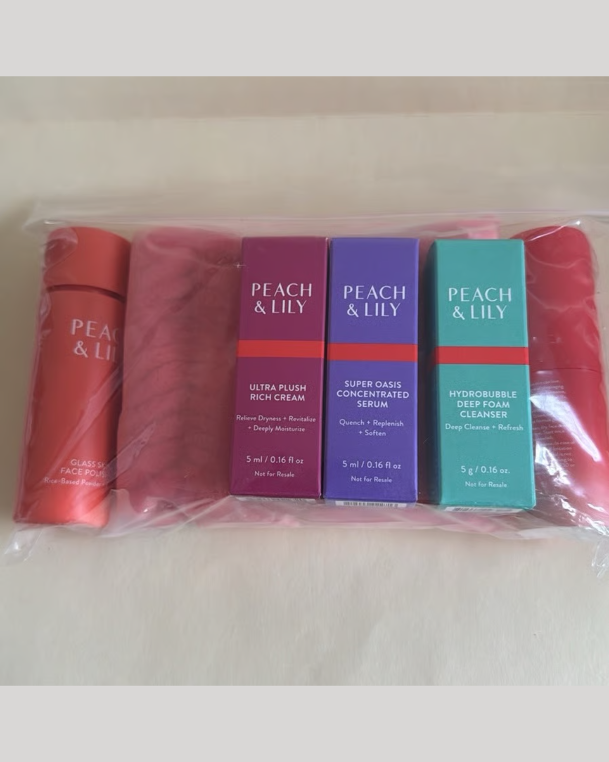 PEACH & LILY 7 Pieces Cleanser Polisher Serums Moisturizer Cream Wristbands